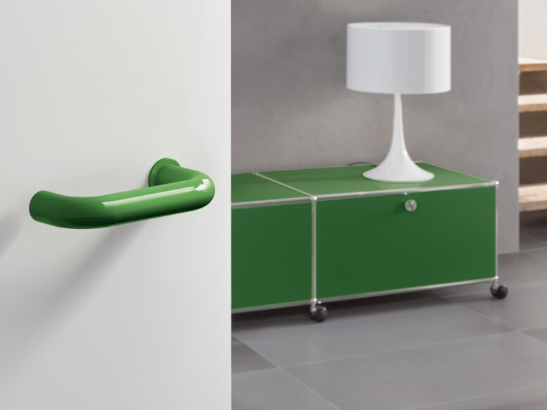 Minimalist lever handle in the colour may green made of polyamide