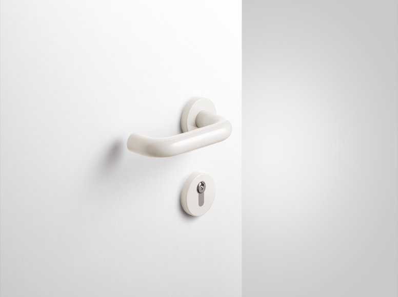 Lever handle with key rosette in the colour pure white made of polyamide