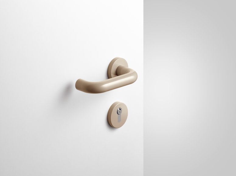 Lever handle with key rosette in the colour sand made of polyamide