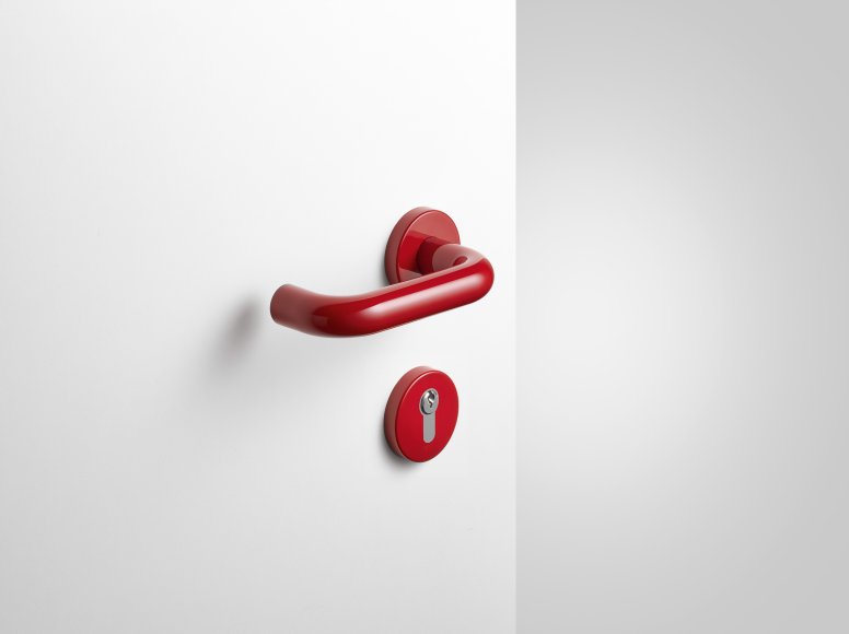 Lever handle with key rosette in the colour ruby red made of polyamide