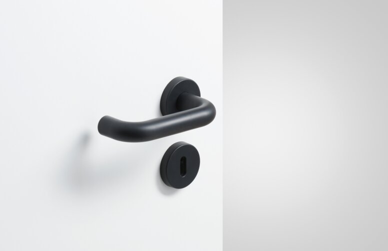 Lever handle with key rosette in the colour deep black matt made of polyamide