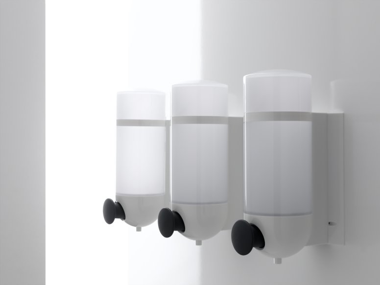 Three HEWI soap dispensers with cylindrical design in white made of polyamide and push button in anthracite