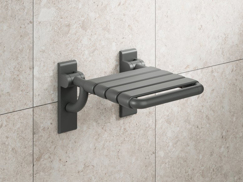 Folding seat for the shower